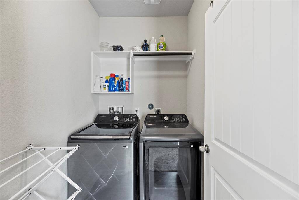 Laundry room is conveniently located upstairs.