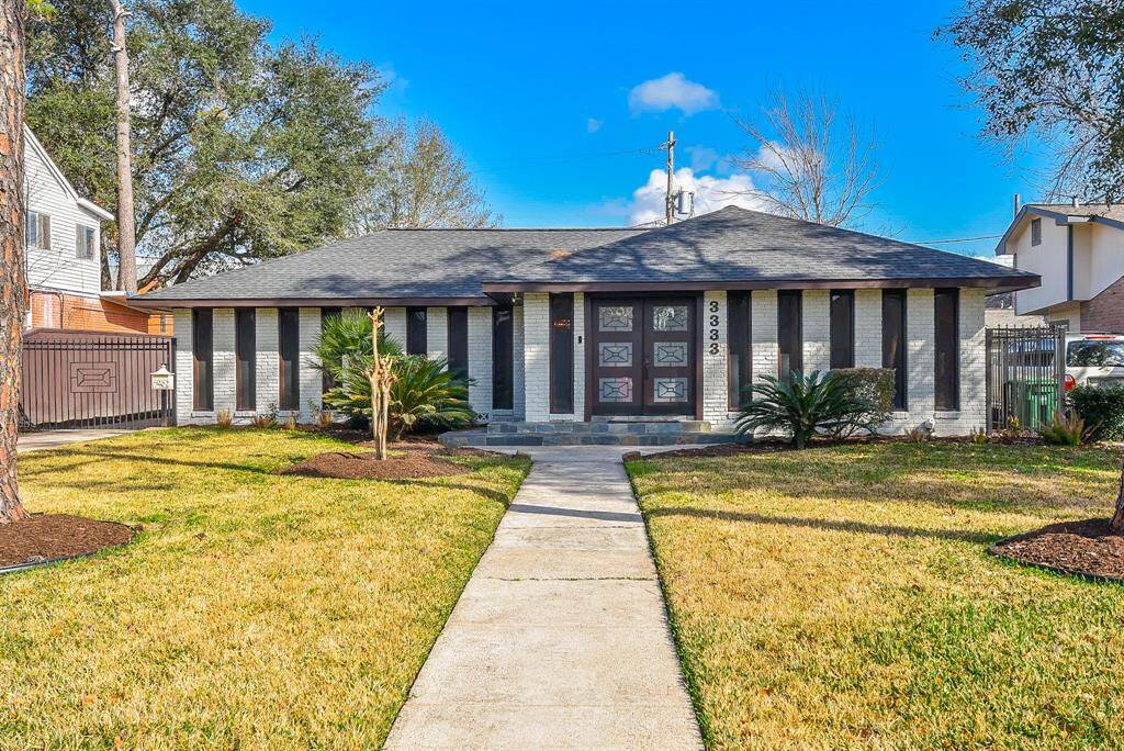 Experience the charm of perfectly manicured front yard landscaping.