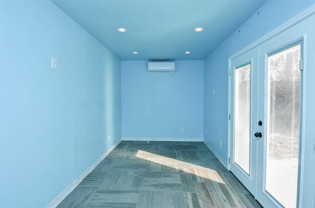 Explore the versatile extra room in the attached garage, perfect for a home gym or office, complete with air conditioning for year-round comfort.