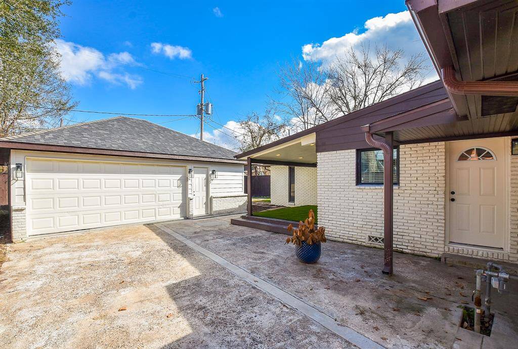 Explore the spacious backyard featuring a versatile detached garage with an extra room, perfect for a home office or gym.