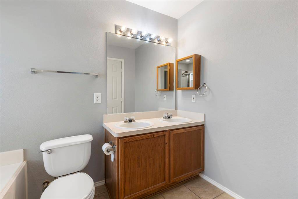Spacious second bathroom with modern fixtures.