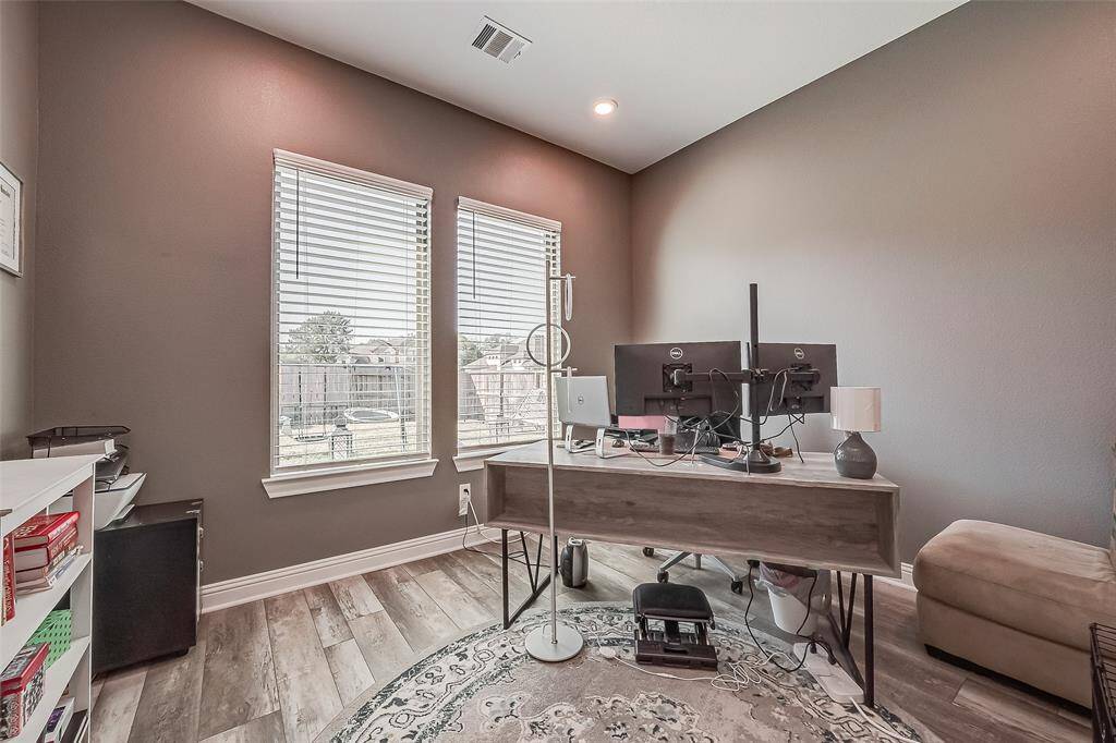 There is a lovely office, perfect for remote working, or a flex space to suit your needs located off of the main living area.