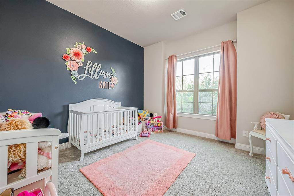 Secondary bedroom downstairs with a walk in closet.