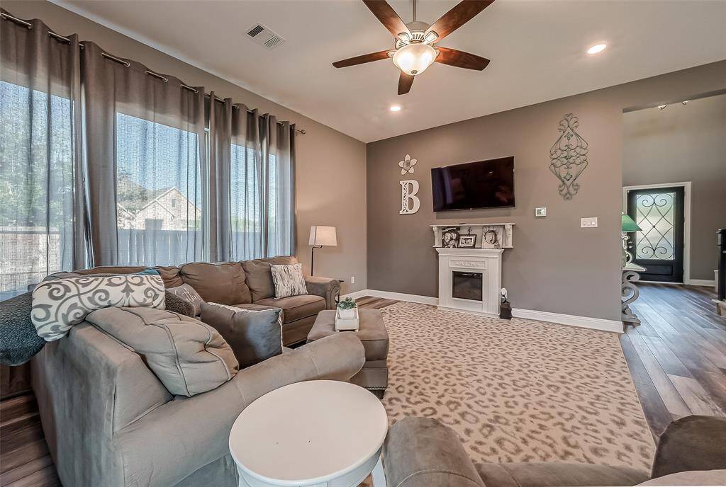 Plentiful windows provide natural light throughout the open floor plan.
