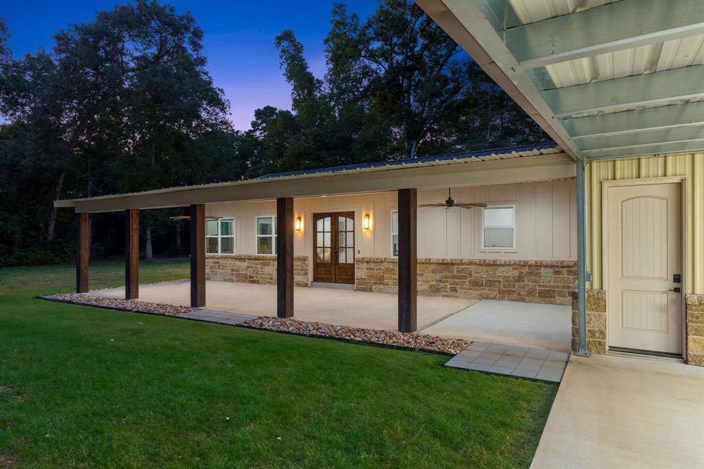 The covered front porch has plenty of space for a sitting area and an outdoor fan.