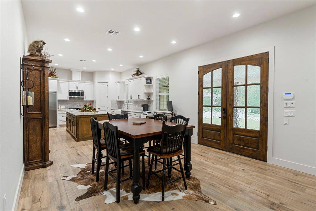 Upon entering is the dining area with recessed lighting.