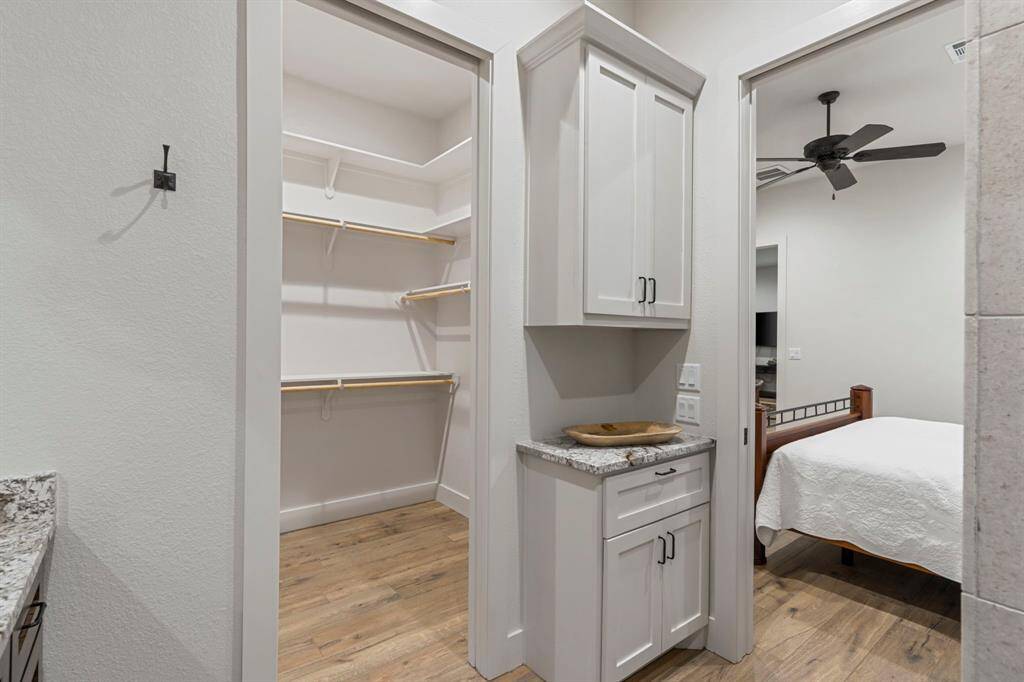 Primary en-suite bathroom features a walk-in closet and plenty of storage space.
