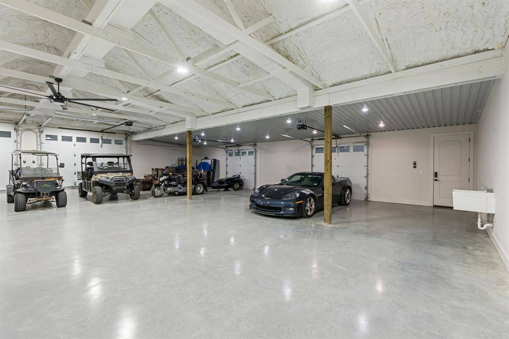 The workshop side of the barndominium features plenty of parking space.
