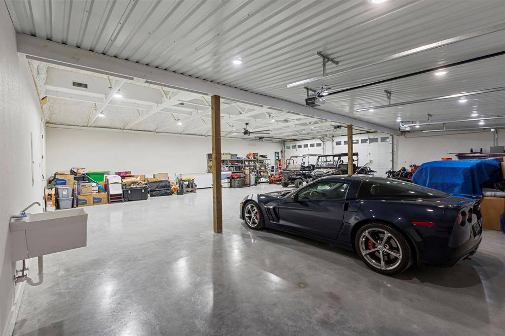 The workshop side of the barndominium features plenty of parking space.
