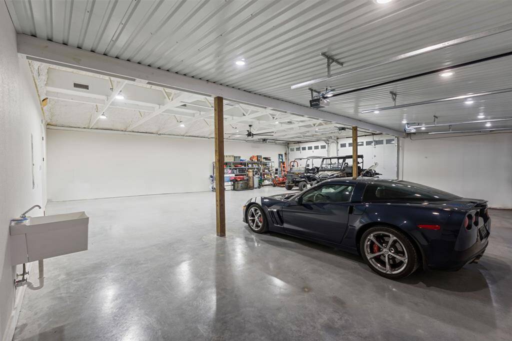 There are 4 garage doors and additional sink.