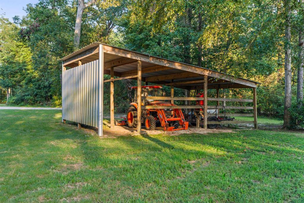 There is also a covered area for tractor/other equipment with plenty of storage space.