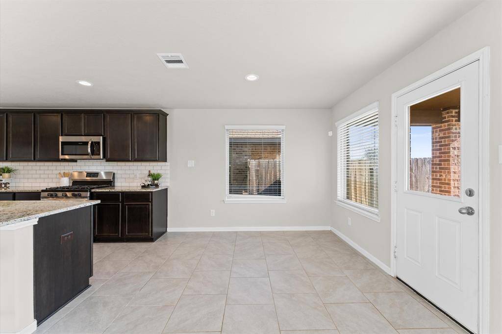 With quick access to the backyard, making indoor-outdoor dining a breeze.