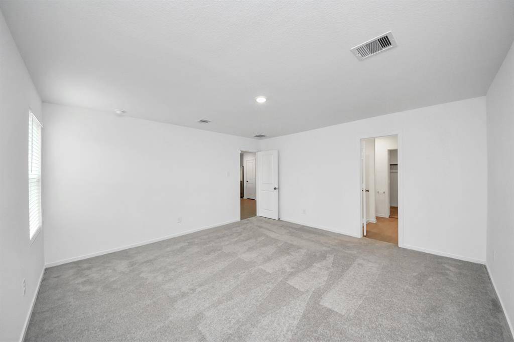 Thoughtfully designed for relaxation, this primary suite provides the perfect blend of style and tranquility, complete with a luxurious ensuite bathroom for added privacy and convenience.