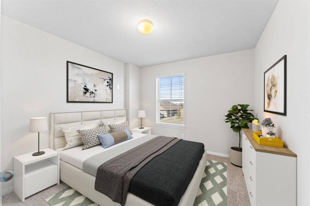 The fourth bedroom is equally inviting, with a soft carpeted floor and a window providing a cheerful ambiance. Perfect for children or guests, the room combines comfort with versatility.