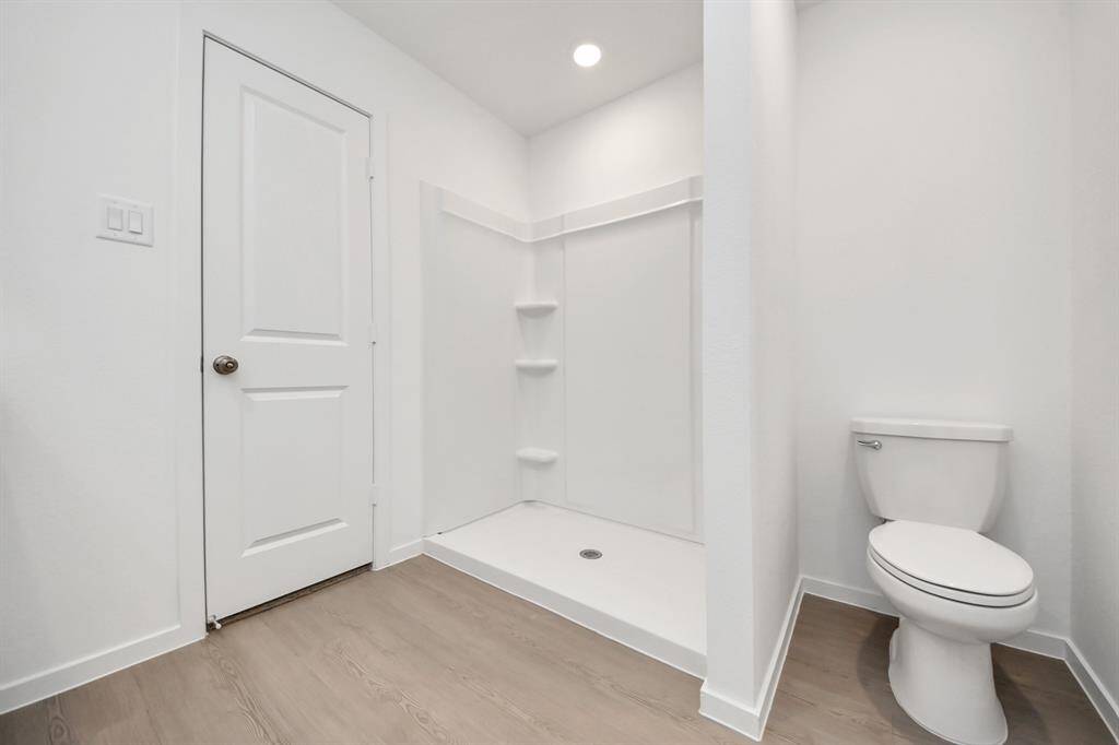 The thoughtfully designed layout ensures comfort and convenience, complete with a  walk-in shower for a refreshing and relaxing experience.