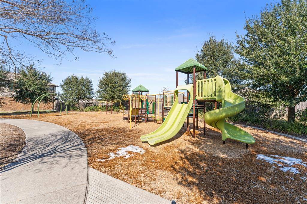 The subdivision playground is a vibrant and cheerful space thoughtfully designed for children to play, explore, and have fun.