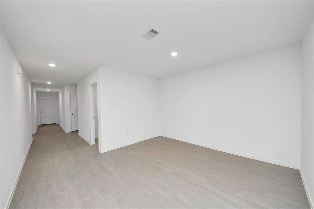 With ample room for a large dining table, this inviting space is ideal for hosting family meals or entertaining guests.