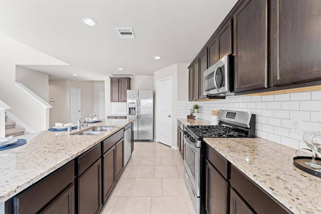 Custom cabinets offer ample storage to keep everything neatly organized.