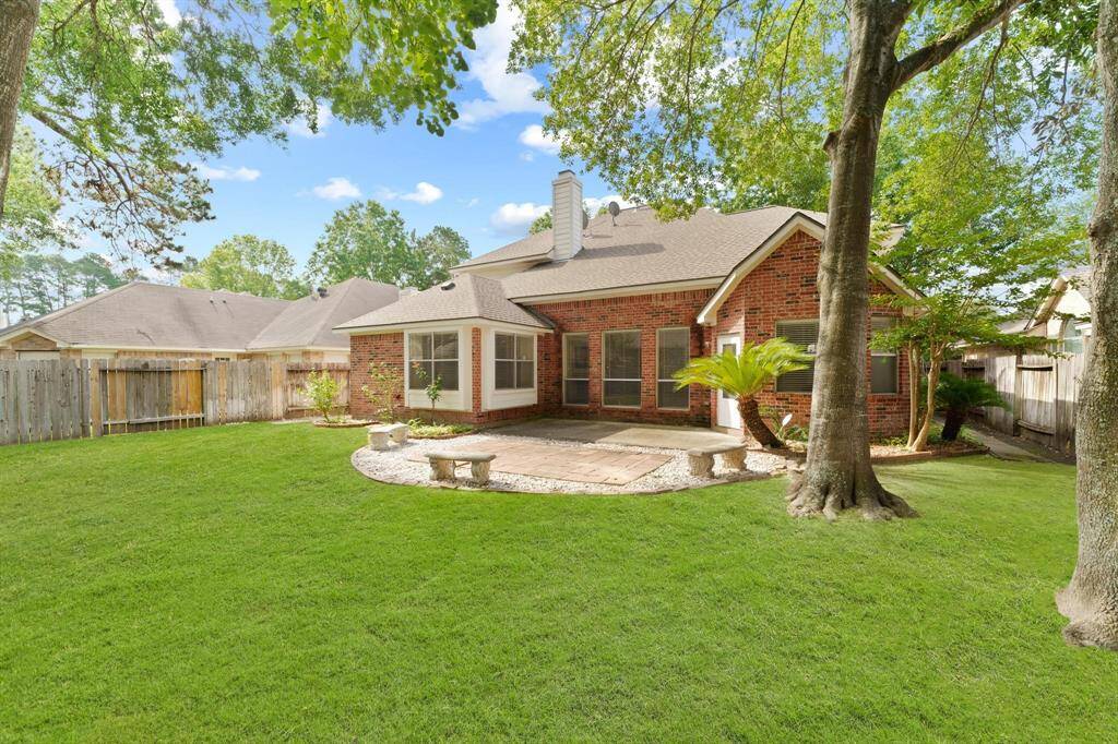 Private backyard with large patio area.