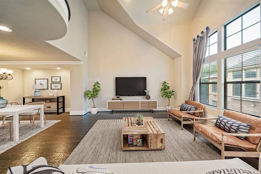 Bask in the warmth of abundant natural light in this elegantly designed living space, skillfully virtually staged to showcase its potential.