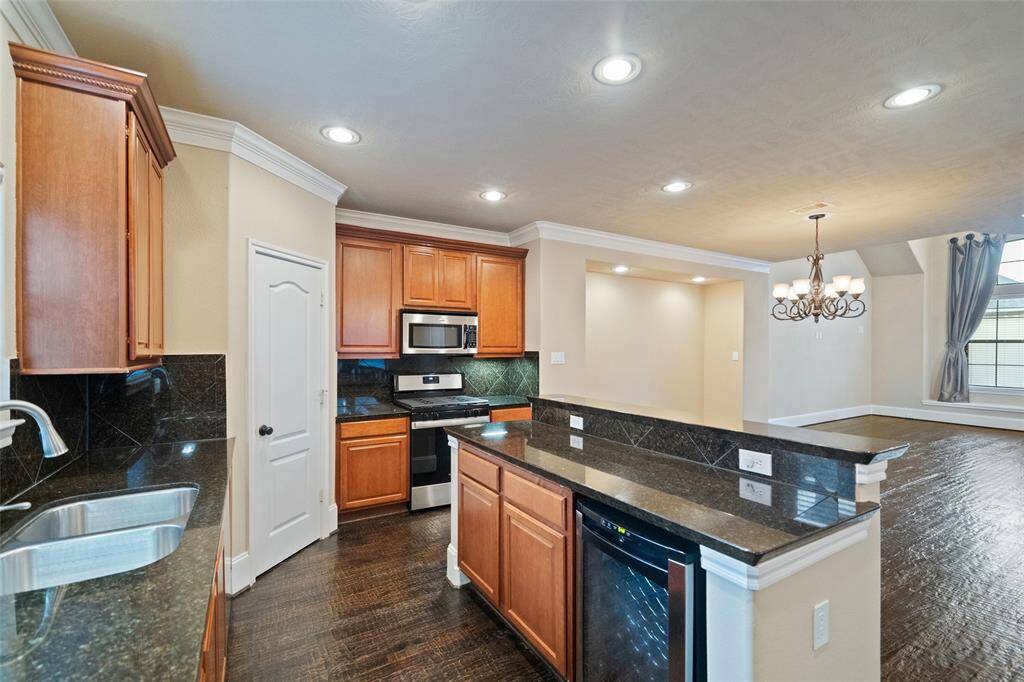Seamless flow from the modern kitchen to the inviting dining and living areas, perfect for entertaining.