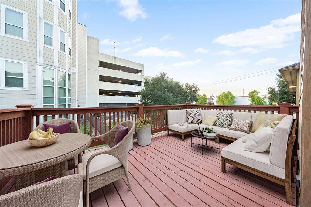 Step from the cozy breakfast nook onto the expansive deck, perfect for seamless indoor-outdoor dining and social gatherings. (Note: Image shows virtual staging.)