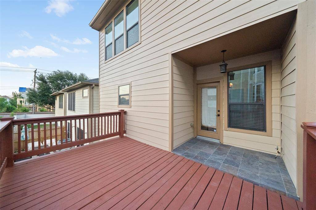 Enjoy serene outdoor living on this spacious, inviting deck, perfect for relaxation or entertaining.