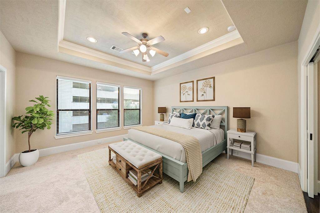 Discover your serene, sunlit oasis with a newly painted and carpeted master suite, ready to welcome you home. (Note: Shown with virtual staging.)