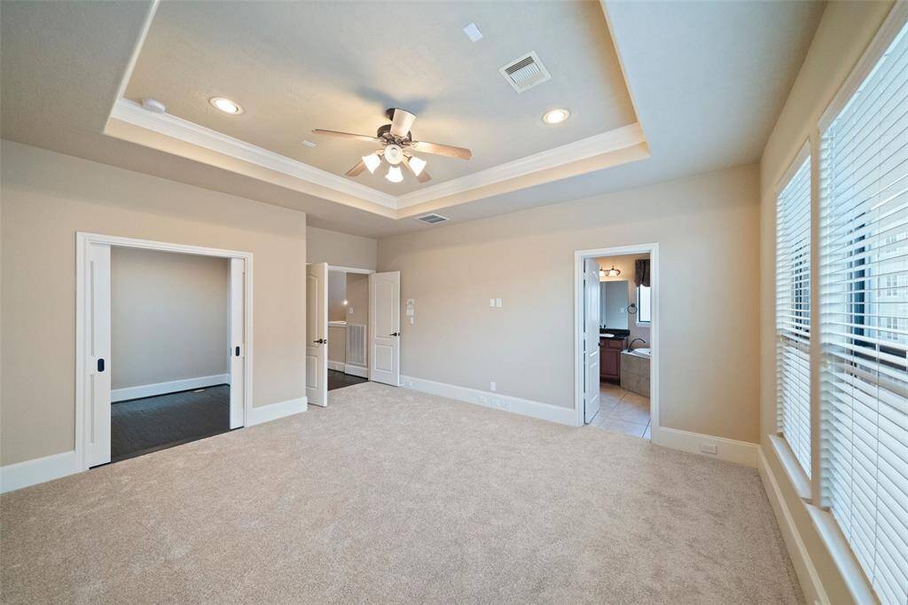 Explore the spacious master suite with its cozy study nook and en-suite bathroom, offering the perfect blend of comfort and convenience.