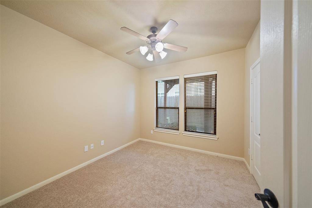 Explore the comfort and versatility of this cozy ground-level bedroom, complete with ambient lighting and a serene view.