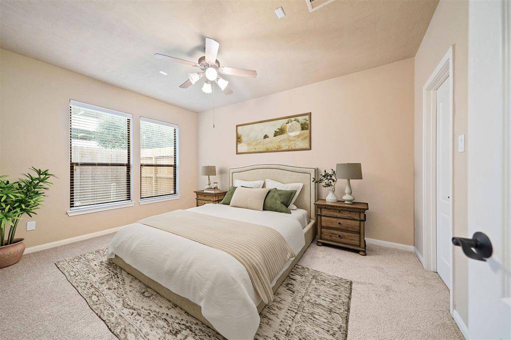 Inviting first-floor bedroom with elegant virtual staging, showcasing versatile space and comfort.