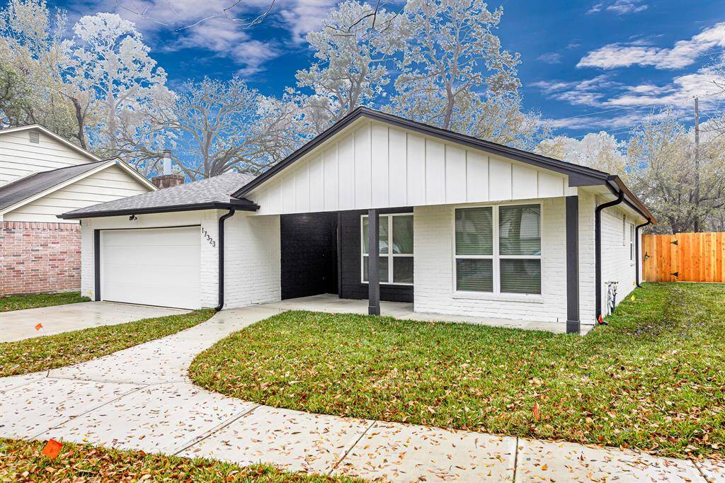 A freshly painted white exterior and brand-new driveway welcome you to this beautifully remodeled home.