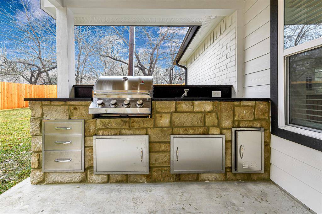 Grill, dine, and relax in this thoughtfully designed backyard oasis.