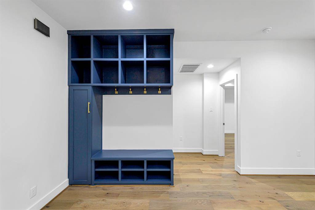 A built-in open locker provides practical and stylish storage solutions inside the home.
