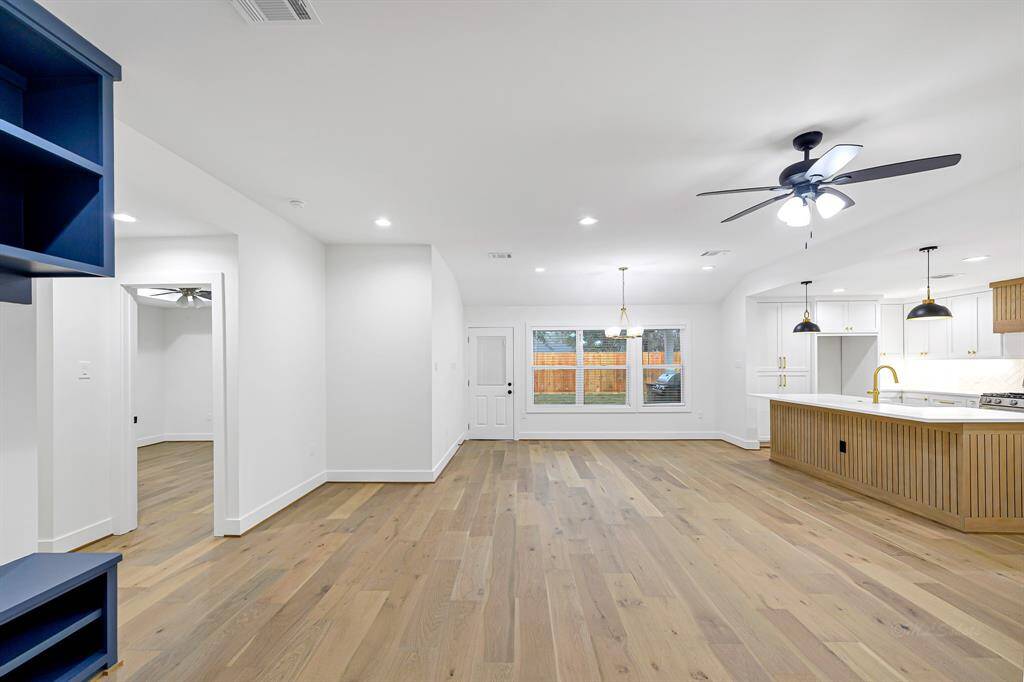 The spacious living area effortlessly flows into the kitchen, creating a perfect space for entertaining.
