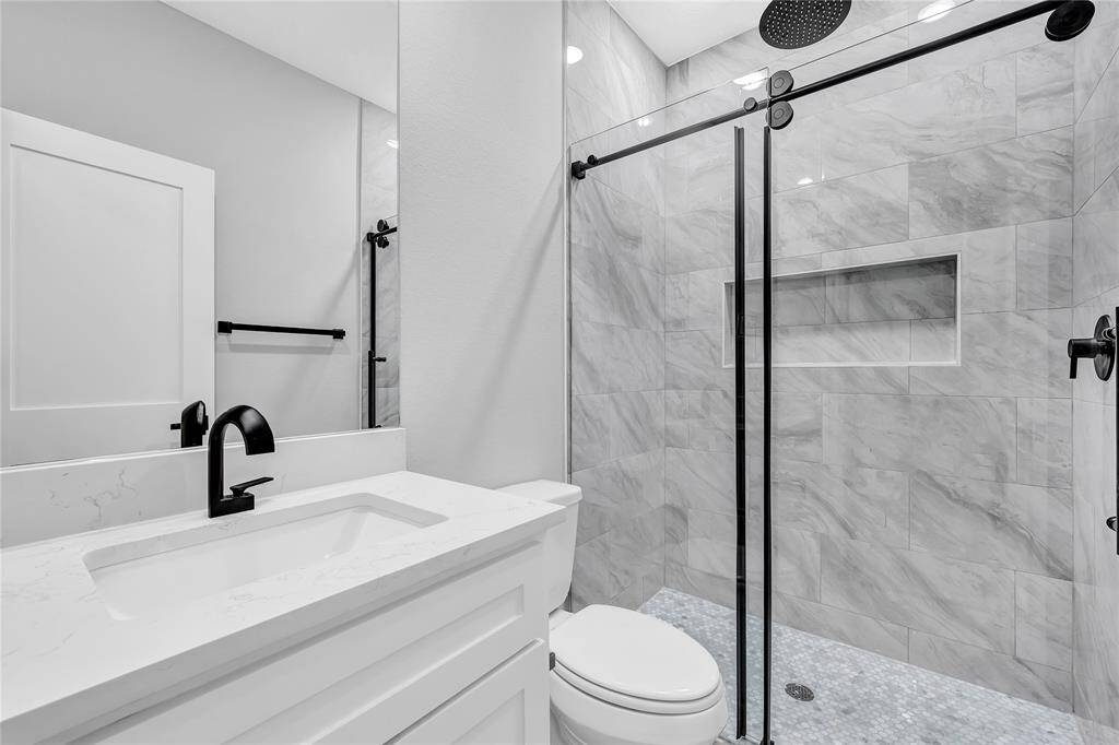 Guest bath. Walk in shower with rain head shower head.