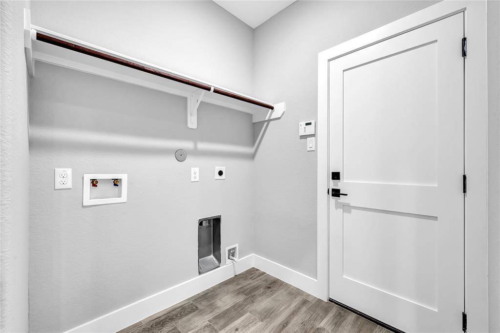 Laundry room and door leading to garage.