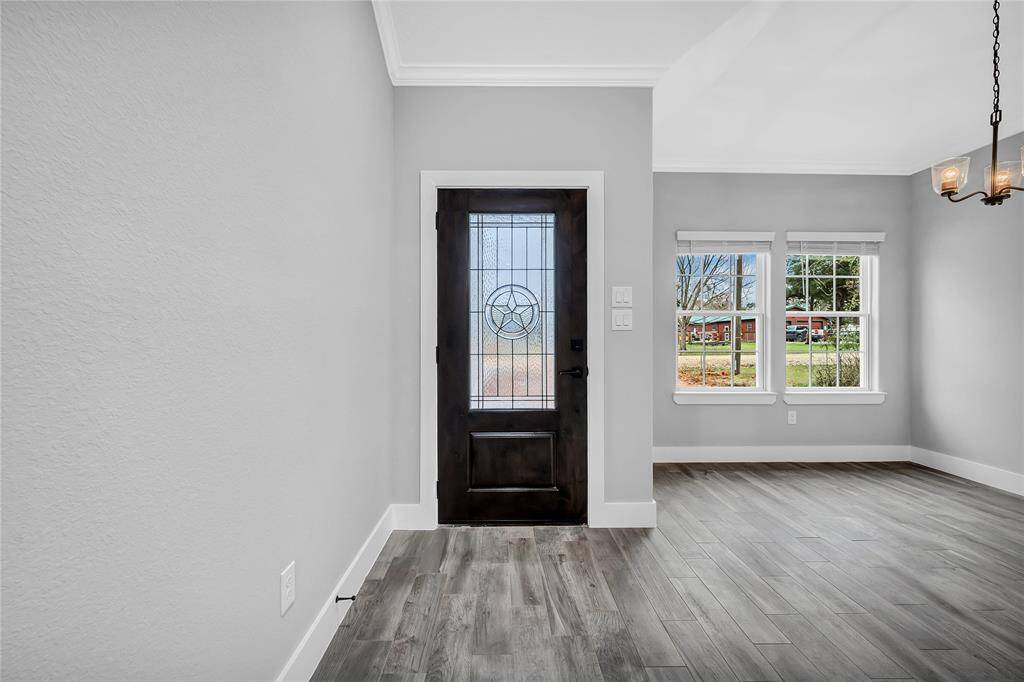 Beautiful wood/glass entry door. As you enter, the formal dining will be to your left.