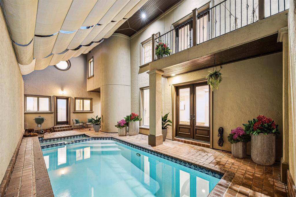 3224 ALABAMA COURT... Central and secluded Mediterranean style home in a small gated enclave is available for immediate occupancy. This amenity-rich 4,476 sq. ft. home has 4/5 bedrooms, 4.5 baths, an open floor plan, rooftop terrace, theatre room, and heated pool/spa.