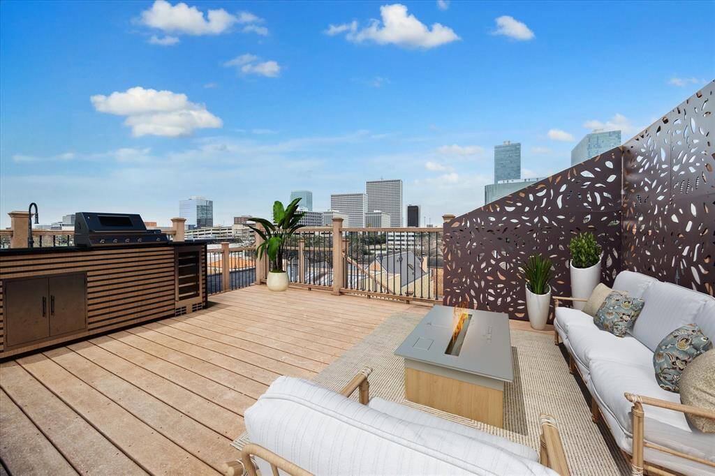 ROOFTOP DECK/TERRACE… Accessed off the third floor, this rooftop terrace has a water connection for easy gardening. Custom aluminum paneling provides additional privacy for this area. Views include downtown, Greenway Plaza, River Oaks Park, and The RO. Virtually staged.