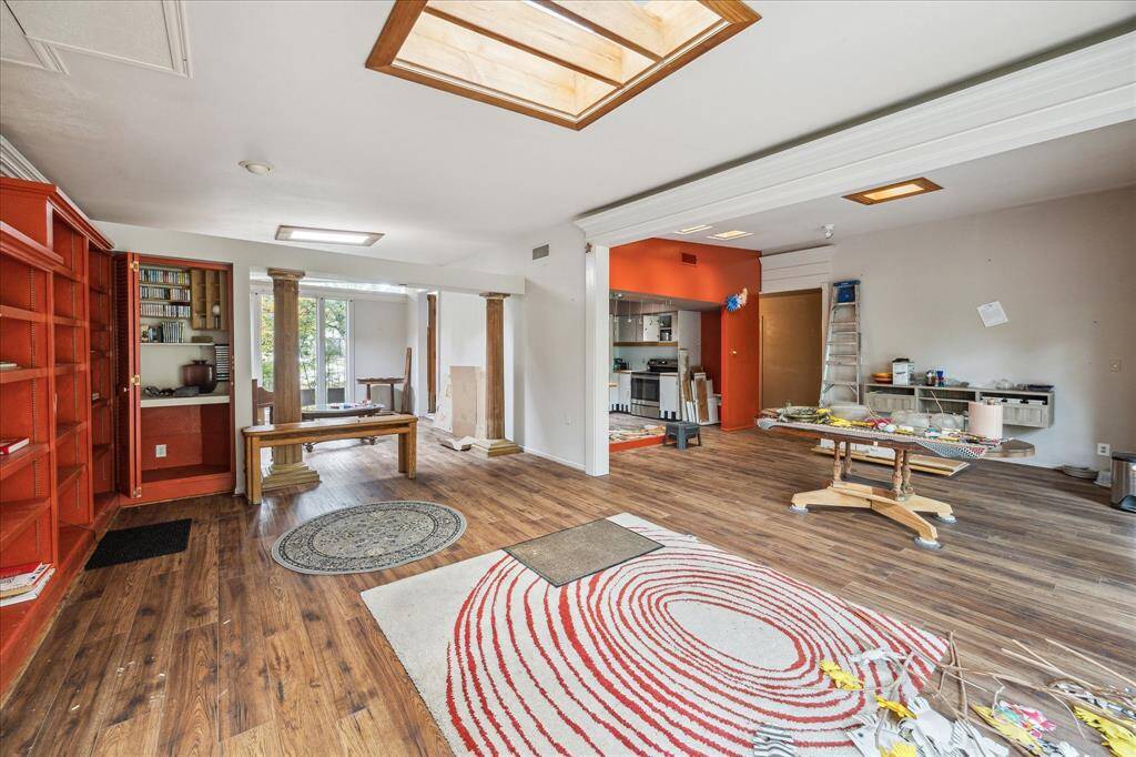 Interior of the residence with the large living and dining areas open to the kitchen.