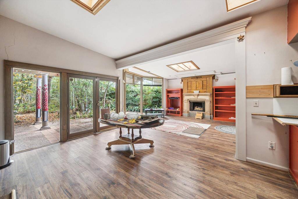 The residence was designed with expansive windows that offer wonderful views of the back patio and Rummel Creek.
