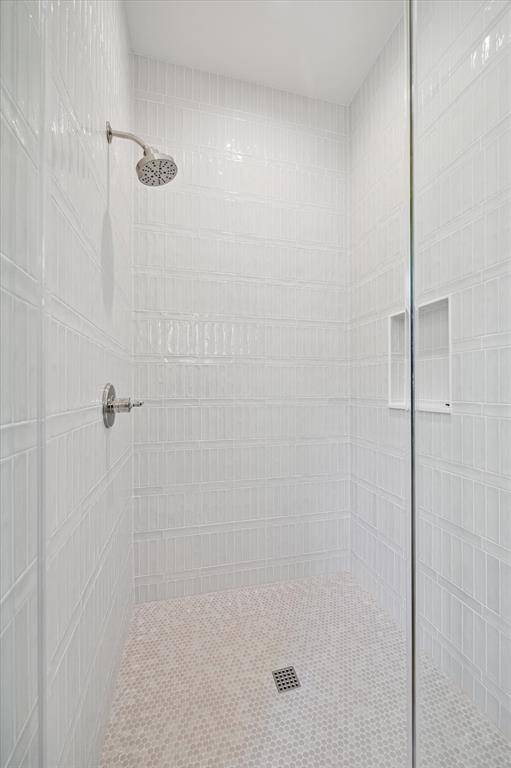 Bath 4 Shower featuring tile from Thorntree and Delta Plumbing fixtures.