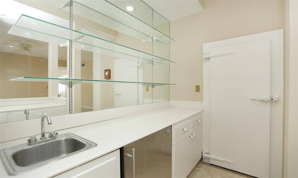 Wet Bar and door to the wine cellar