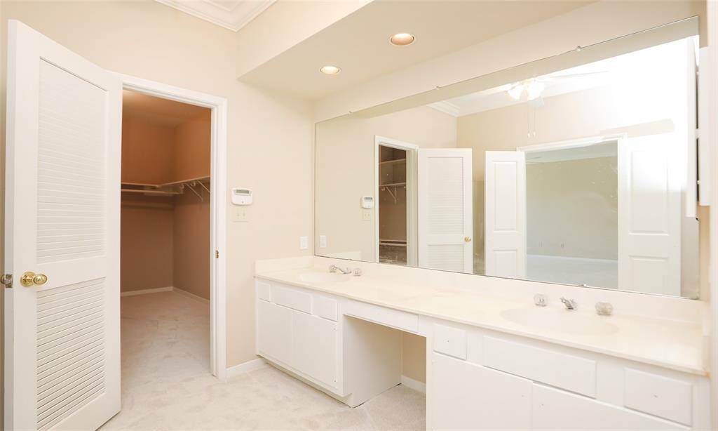Primary bathroom room vanity and closet