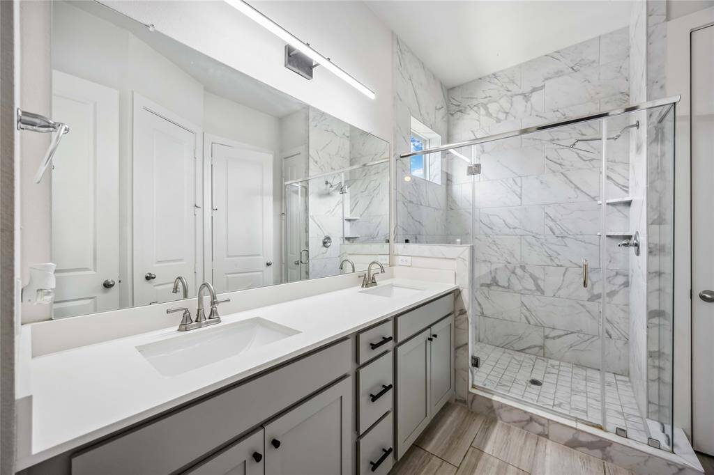 Primary bathroom with double sinks.