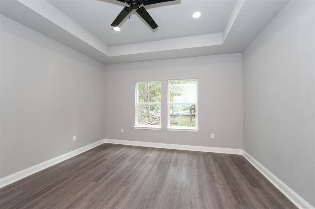 This spacious bedroom offers a peaceful retreat with plenty of natural light and room to relax. Its airy atmosphere and ample space create the perfect environment for comfort and tranquility.