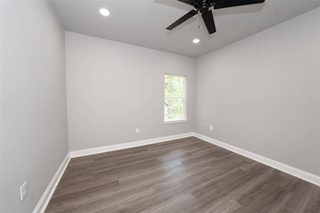 Enjoy a spacious bedroom in this inviting, modern two-story home with charming brick and siding accents. Nestled in a wooded area, the home offers a peaceful and private retreat, complete with a generous driveway, a two-car garage, and a welcoming covered entryway. The lush greenery surrounding the property adds to its serene and cozy appeal.