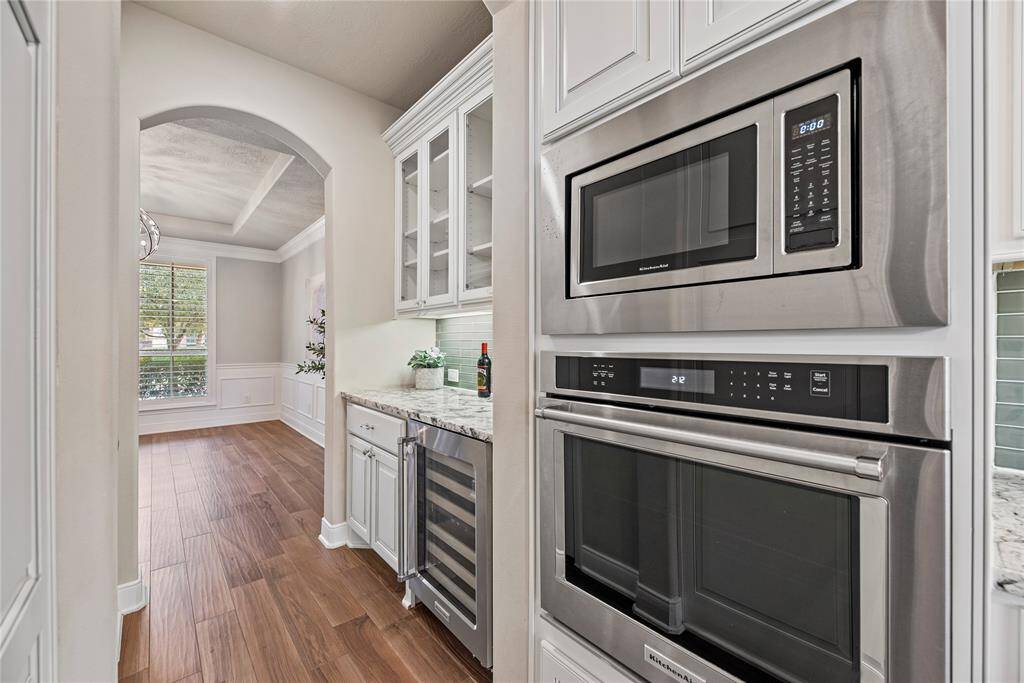 Convenient and stylish butler’s pantry, featuring extra storage, prep space, and a built-in wine fridge for effortless entertaining.