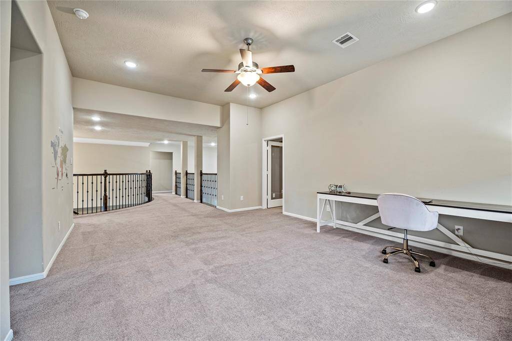 This very spacious game and family room has plenty of space for a game table and other large furnishings.
